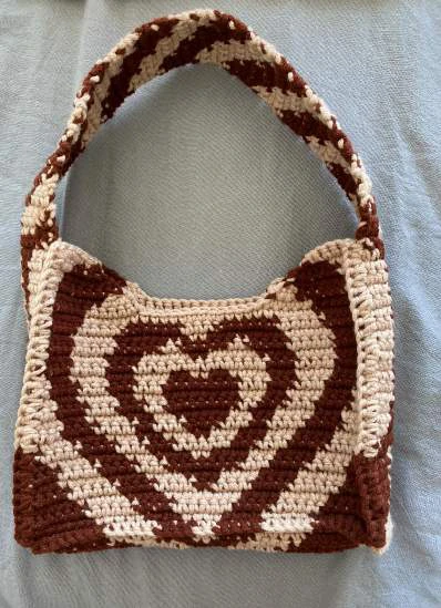 Heart shoulder bag visual from source page 21