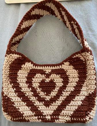 Heart shoulder bag visual from source page 23
